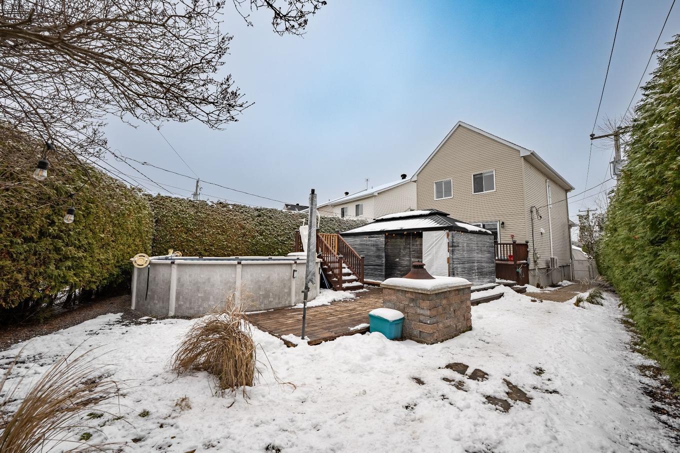 Backyard - 653 Rue Des Dahlias, Saint-Eustache, QC - Outdoor With Above Ground Pool