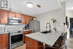 Quartz countertops w stainless appliances -