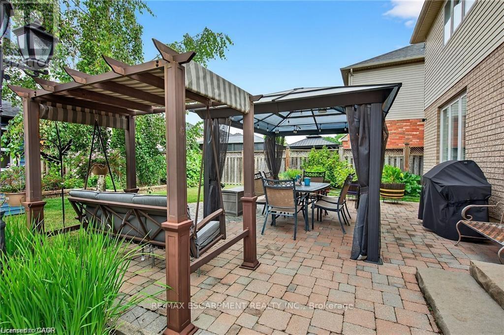 Yard w/gazebo, shed, fenced yard, interlock patio - 39 Wilbur Drive, Hamilton, ON - Outdoor With Exterior