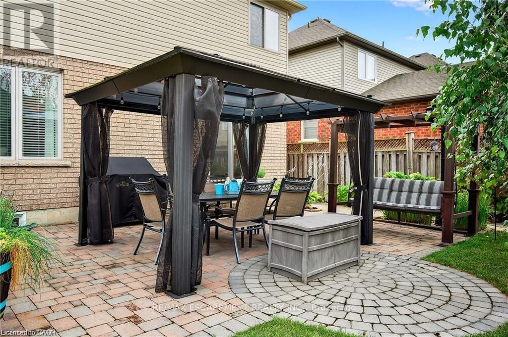 Yard w/gazebo, shed, fenced yard, interlock patio - 39 Wilbur Drive, Hamilton, ON - Outdoor With Exterior