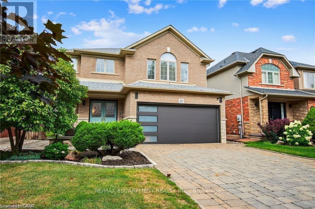 Interlock driveway, parking for 4 cars, landscaped - 39 Wilbur Drive, Hamilton, ON - Outdoor With Facade