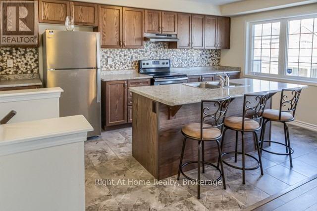 683 Laking Terrace, Milton (Cl Clarke), ON - Indoor Photo Showing Kitchen With Stainless Steel Kitchen