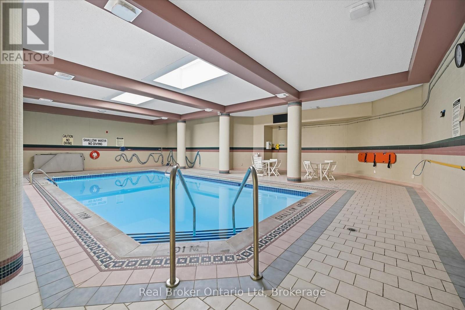 524 - 8111 Forest Glen Drive, Niagara Falls (Mt. Carmel), ON - Indoor Photo Showing Other Room With In Ground Pool