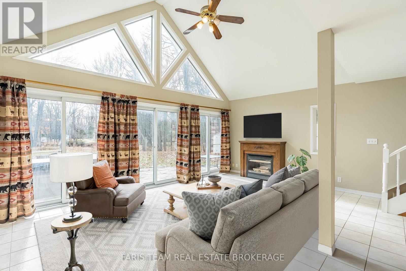 Digitally Staged - 7516 Island Crescent, Ramara, ON - Indoor Photo Showing Living Room With Fireplace
