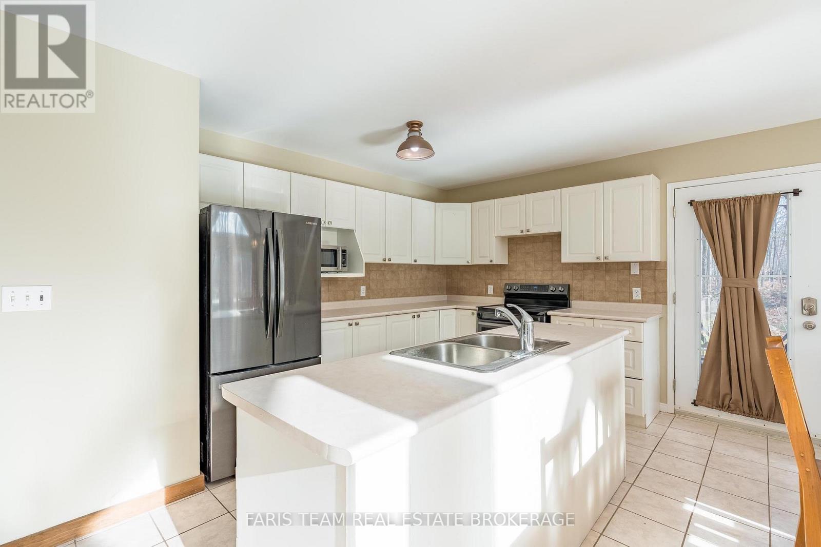 7516 Island Crescent, Ramara, ON - Indoor Photo Showing Kitchen With Double Sink