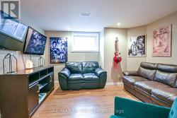 Lower Level Seating Area with Above Grade Windows. -