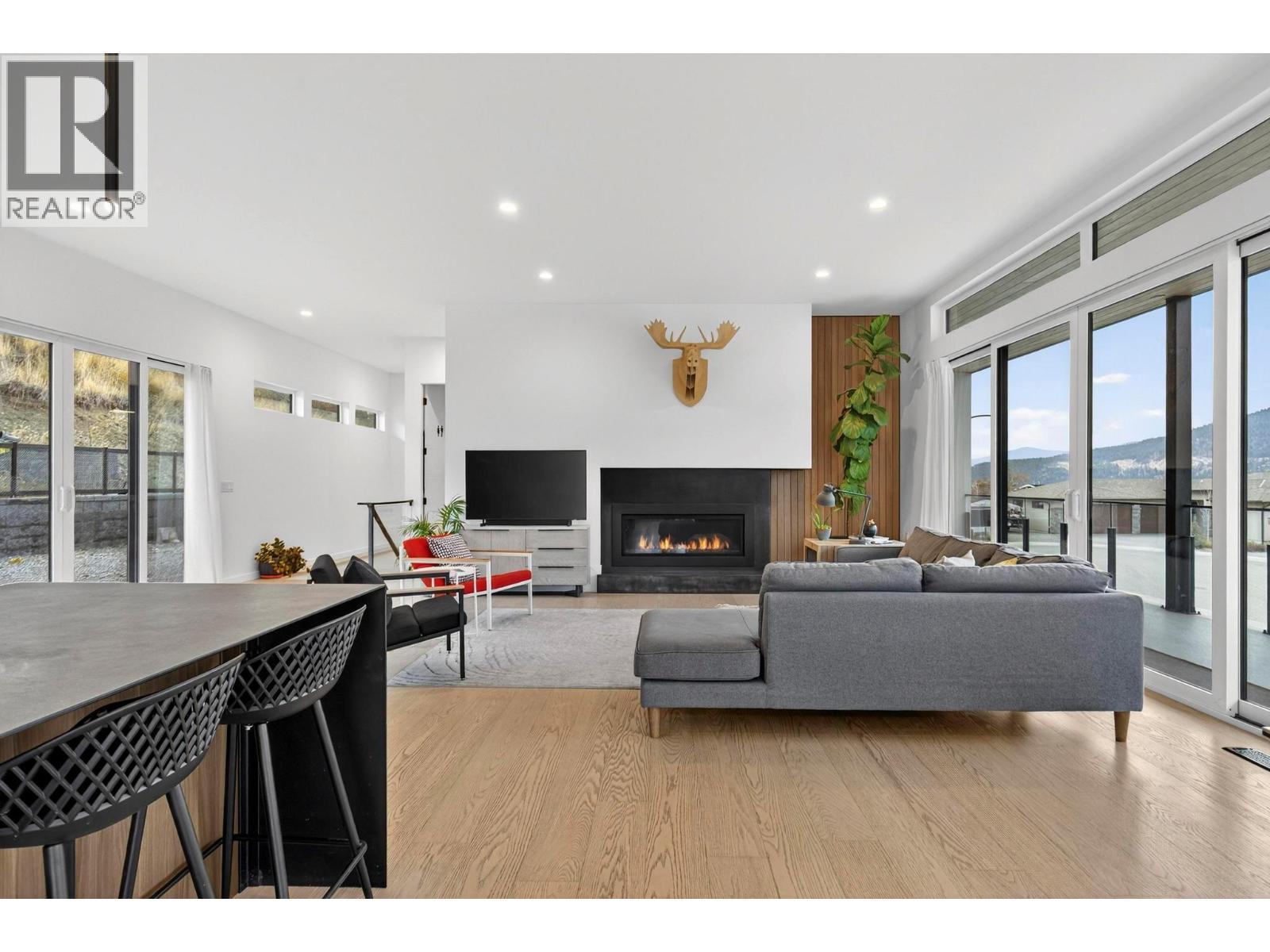 15873 Kobayashi Court, Lake Country, BC - Indoor Photo Showing Living Room With Fireplace