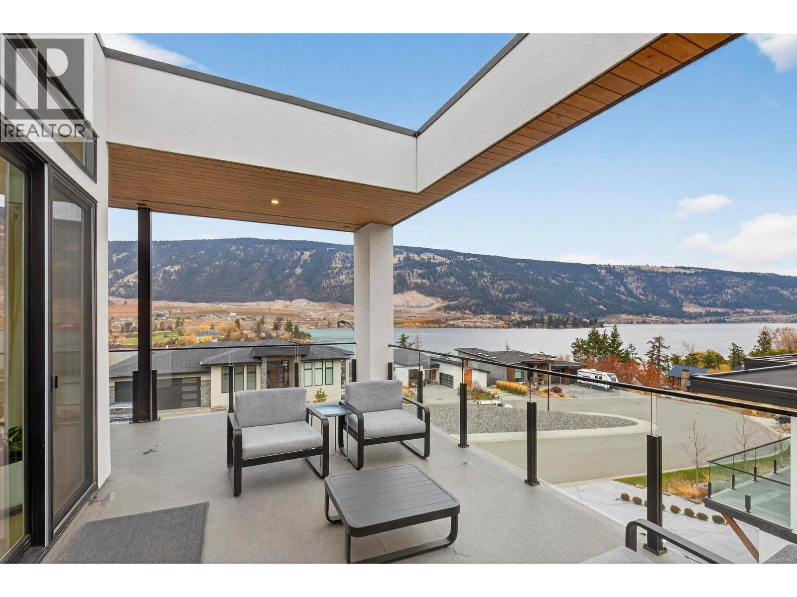 1000 SQ FT of patio spanning 3 sides - 15873 Kobayashi Court, Lake Country, BC - Outdoor With Body Of Water With View With Exterior