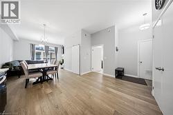Dining room featuring a chandelier and light wood finished floors -