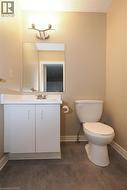 Bathroom featuring vanity and concrete floors -