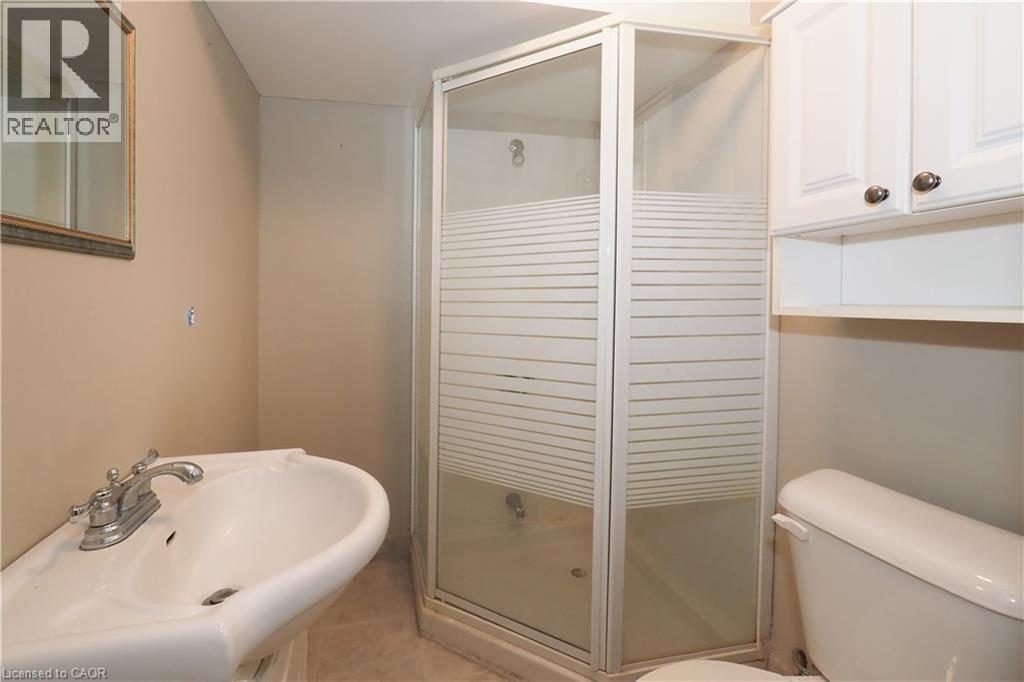 Bathroom featuring a stall shower and light tile patterned floors - 255 Northlake Drive Unit# 27, Waterloo, ON - Indoor Photo Showing Bathroom
