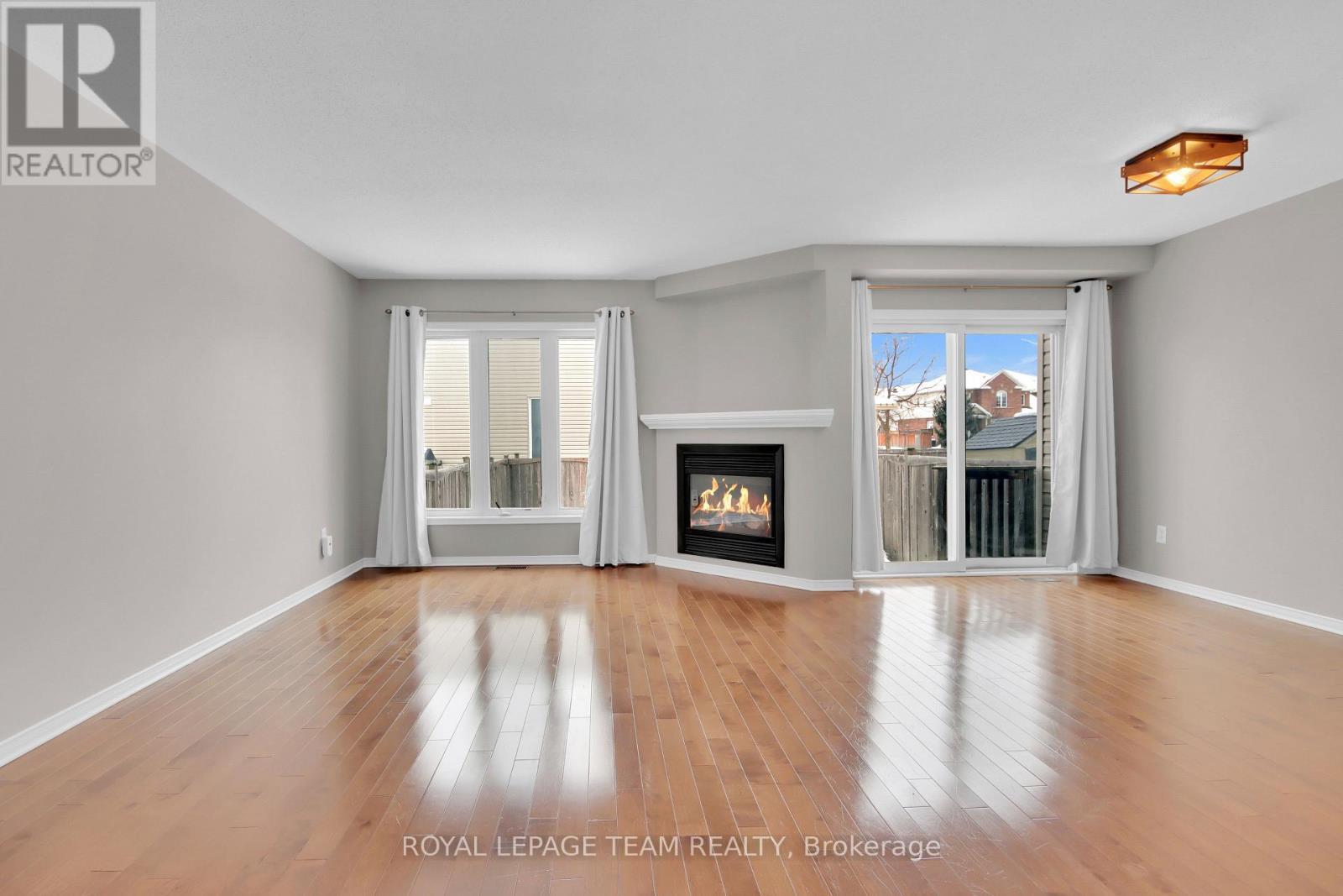 Living Room - 70 Mcbrien Street, Ottawa, ON - Indoor Photo Showing Living Room With Fireplace