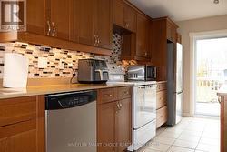 A full wall of counters and cupboards in kitchen -