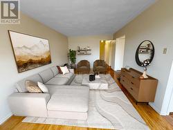Living room with hardwood. Virtually staged. -