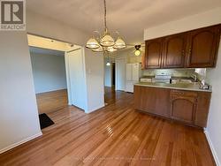 Dining area with hardwood -