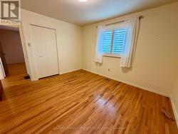 Primary bedroom. Hardwood and California Shutters -