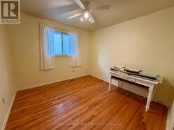 Bedroom 2 with hardwood -
