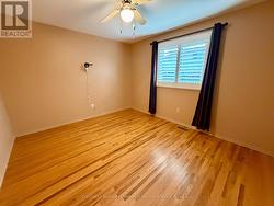 3rd bedroom with hardwood and California Shutters -