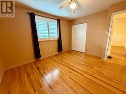 3rd bedroom with hardwood and California Shutters -