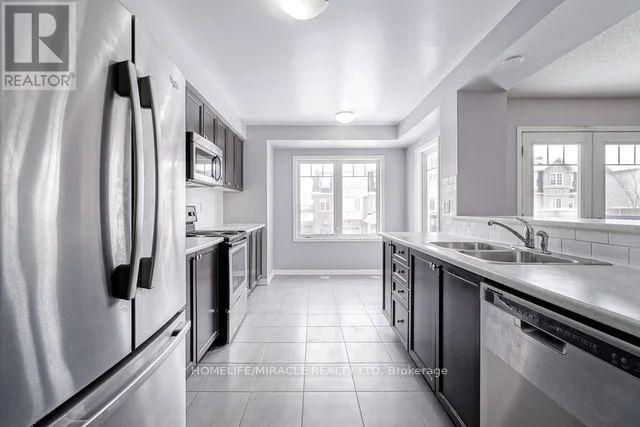 43 Colonel Frank Cheng Crescent, Brampton, ON - Indoor Photo Showing Kitchen With Stainless Steel Kitchen With Double Sink With Upgraded Kitchen