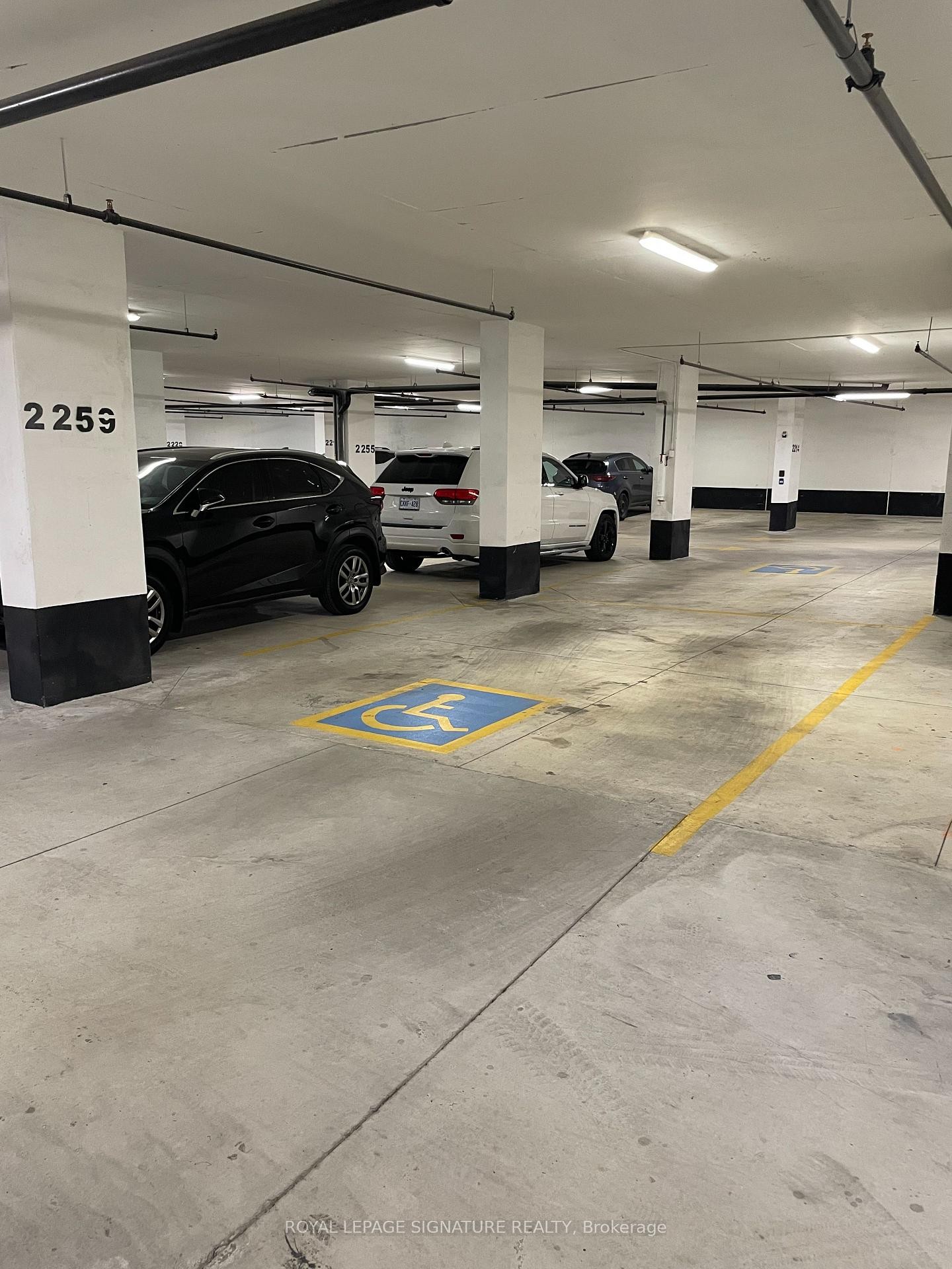 201-60 George Butchart Drive, Toronto, ON - Indoor Photo Showing Garage