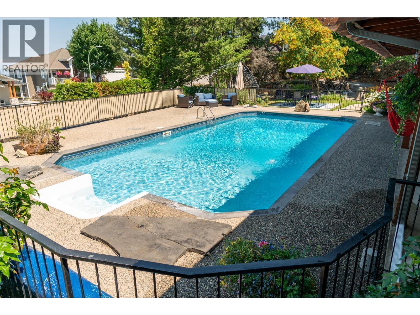 514 Hawes Court, Kelowna, BC - Outdoor With In Ground Pool With Deck Patio Veranda With Backyard