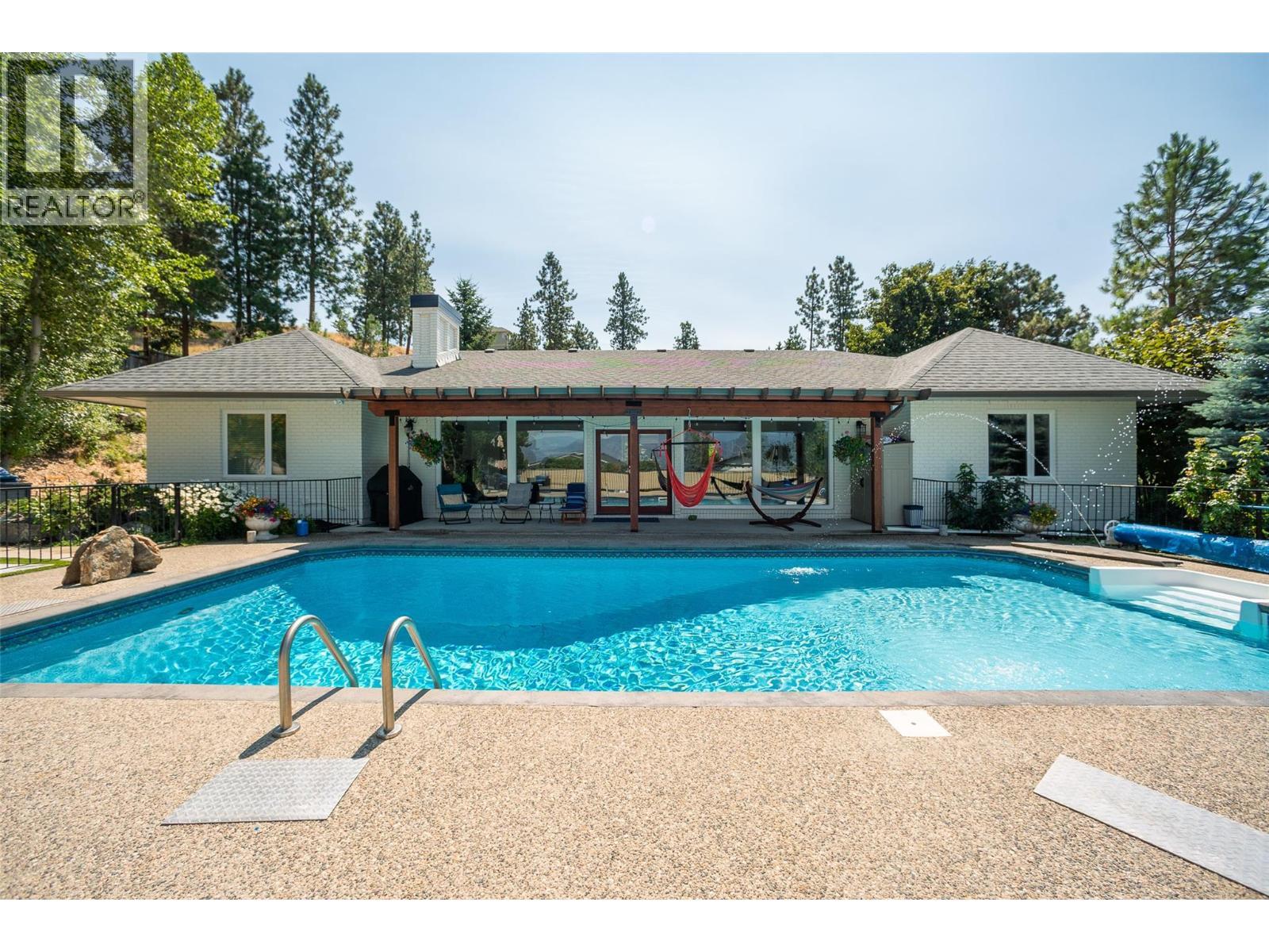 514 Hawes Court, Kelowna, BC - Outdoor With In Ground Pool With Backyard