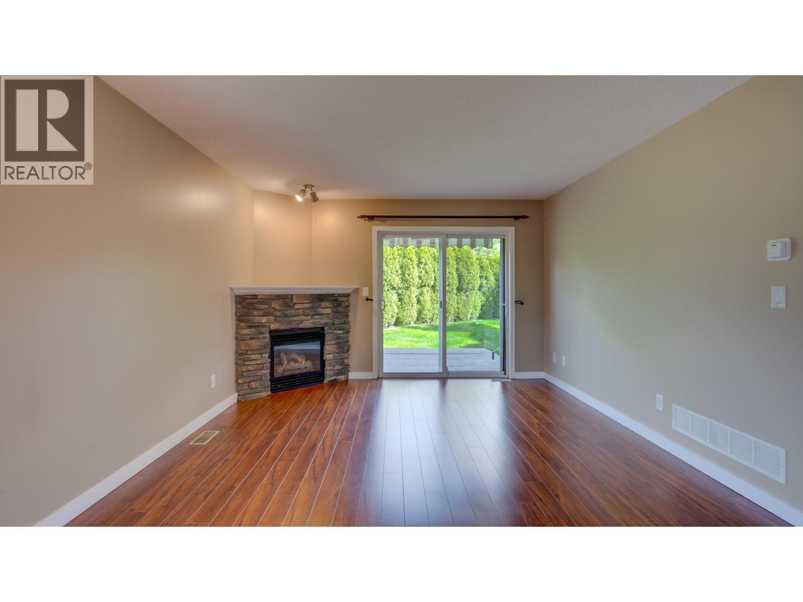 Living Room - 5200 25Th Avenue, Vernon, BC - Indoor Photo Showing Living Room With Fireplace