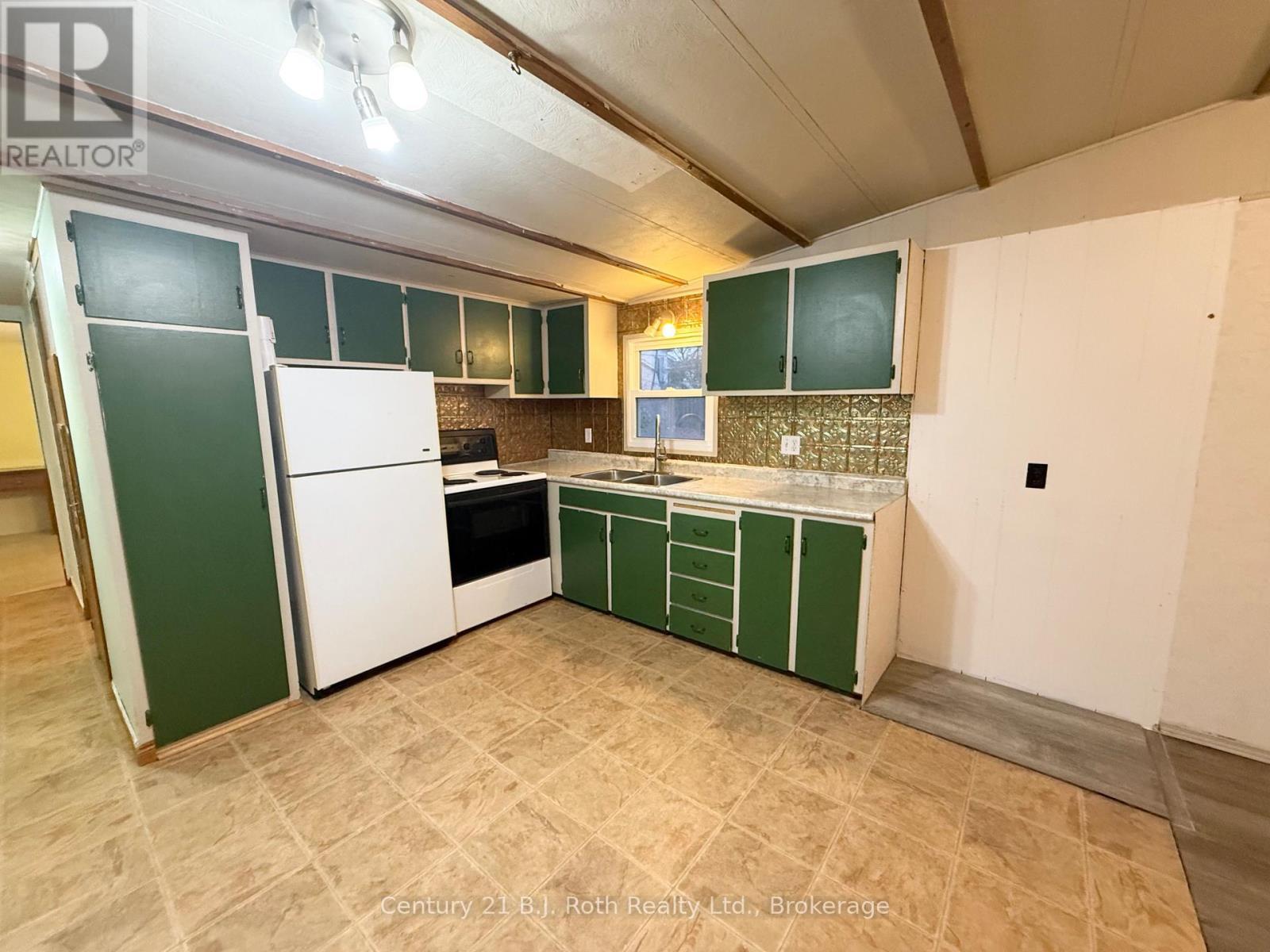 161 - 580 West Street S, Orillia, ON - Indoor Photo Showing Kitchen With Double Sink