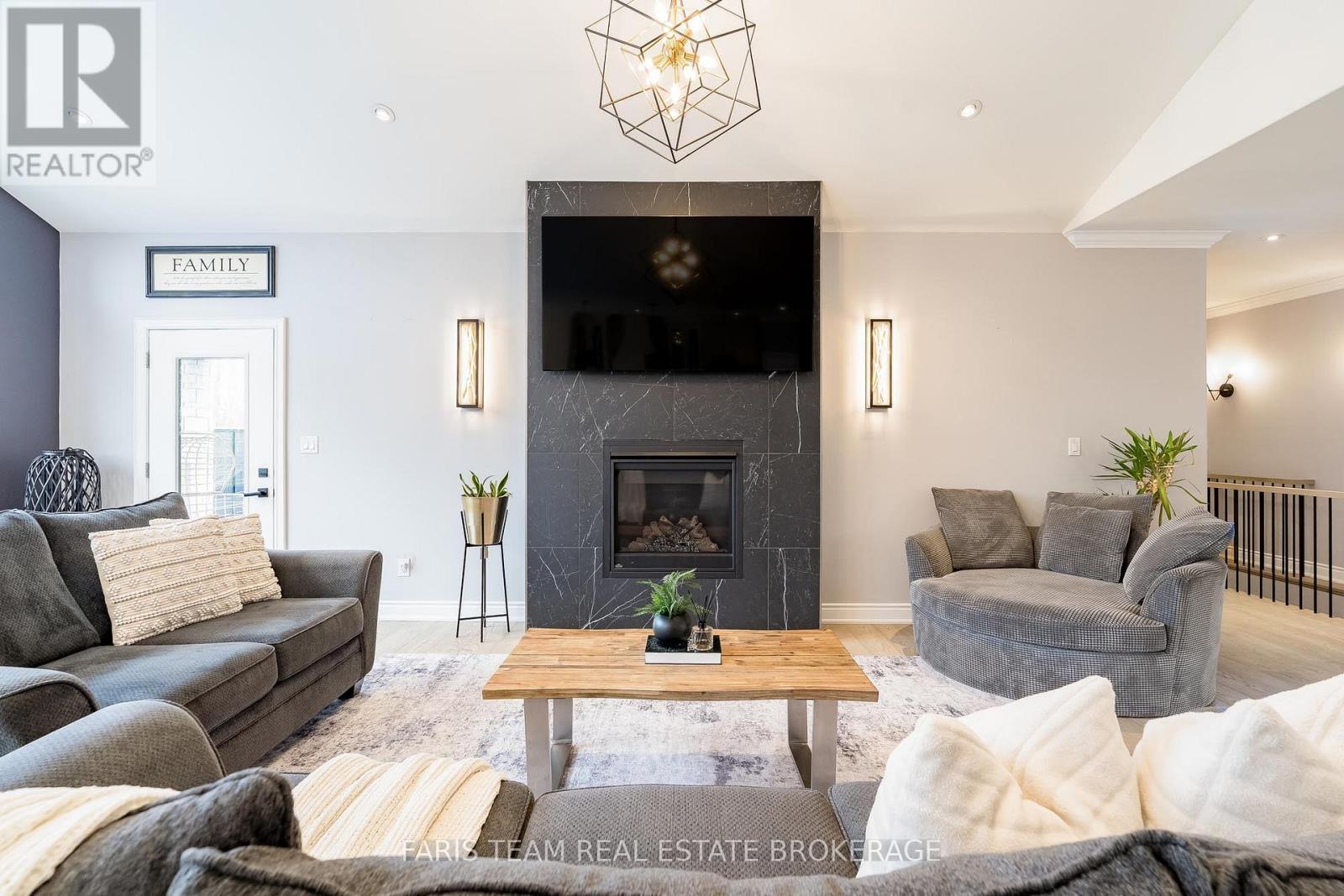 9 Byers Street, Springwater, ON - Indoor Photo Showing Living Room With Fireplace