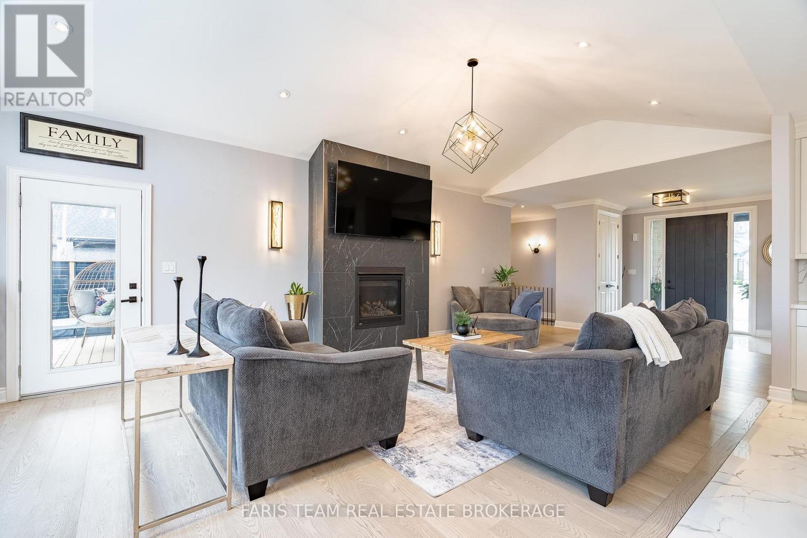 9 Byers Street, Springwater, ON - Indoor Photo Showing Living Room With Fireplace