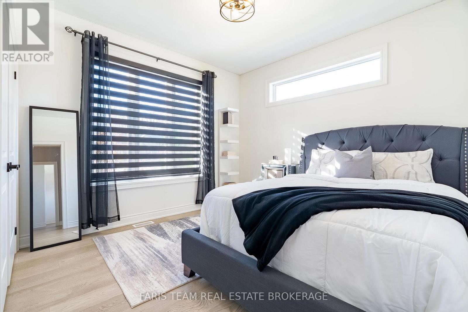 9 Byers Street, Springwater, ON - Indoor Photo Showing Bedroom
