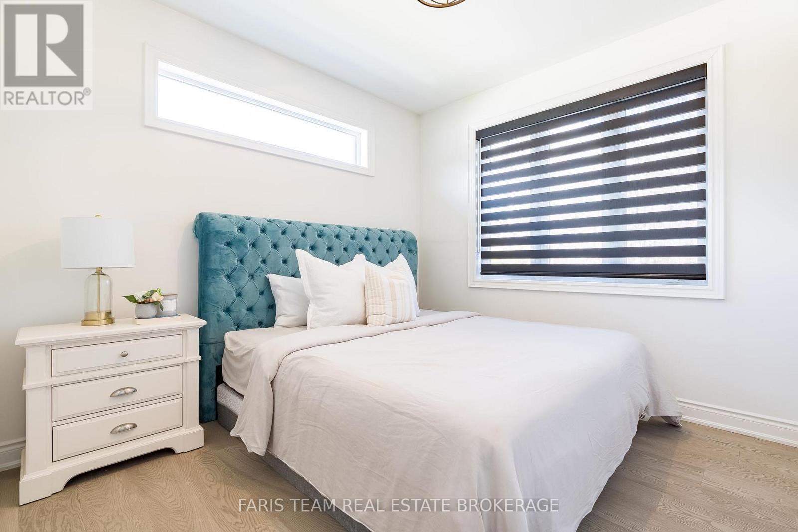 9 Byers Street, Springwater, ON - Indoor Photo Showing Bedroom