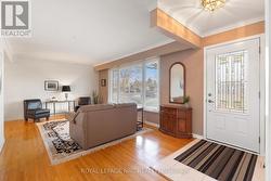 Living room with hardwood floor. -