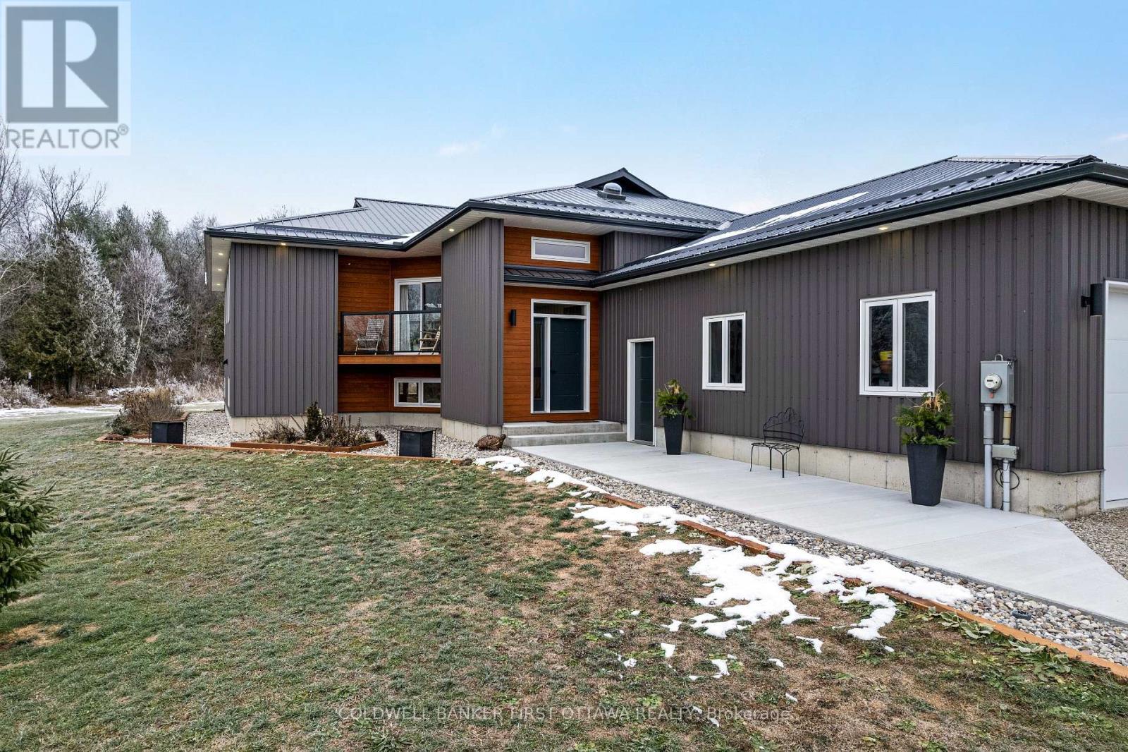 Slate-hued steel siding and top quality steel roof - 462 Althorpe Road, Tay Valley, ON - Outdoor