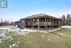 Steel fascia has recessed soffit lighting -