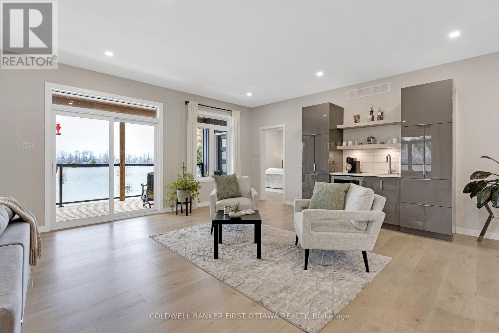 Luxury vinyl plank floors with cork cushioning - 462 Althorpe Road, Tay Valley, ON - Indoor Photo Showing Living Room