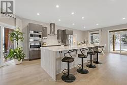 Impeccable kitchen has Cambrian quartz counters -