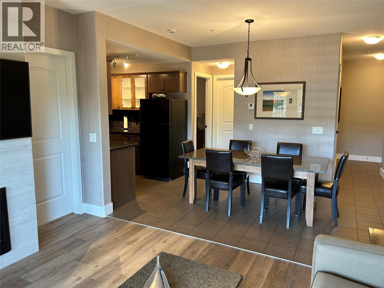 1200 Rancher Creek Road Unit# 131Ab, Osoyoos, BC - Indoor Photo Showing Dining Room With Fireplace