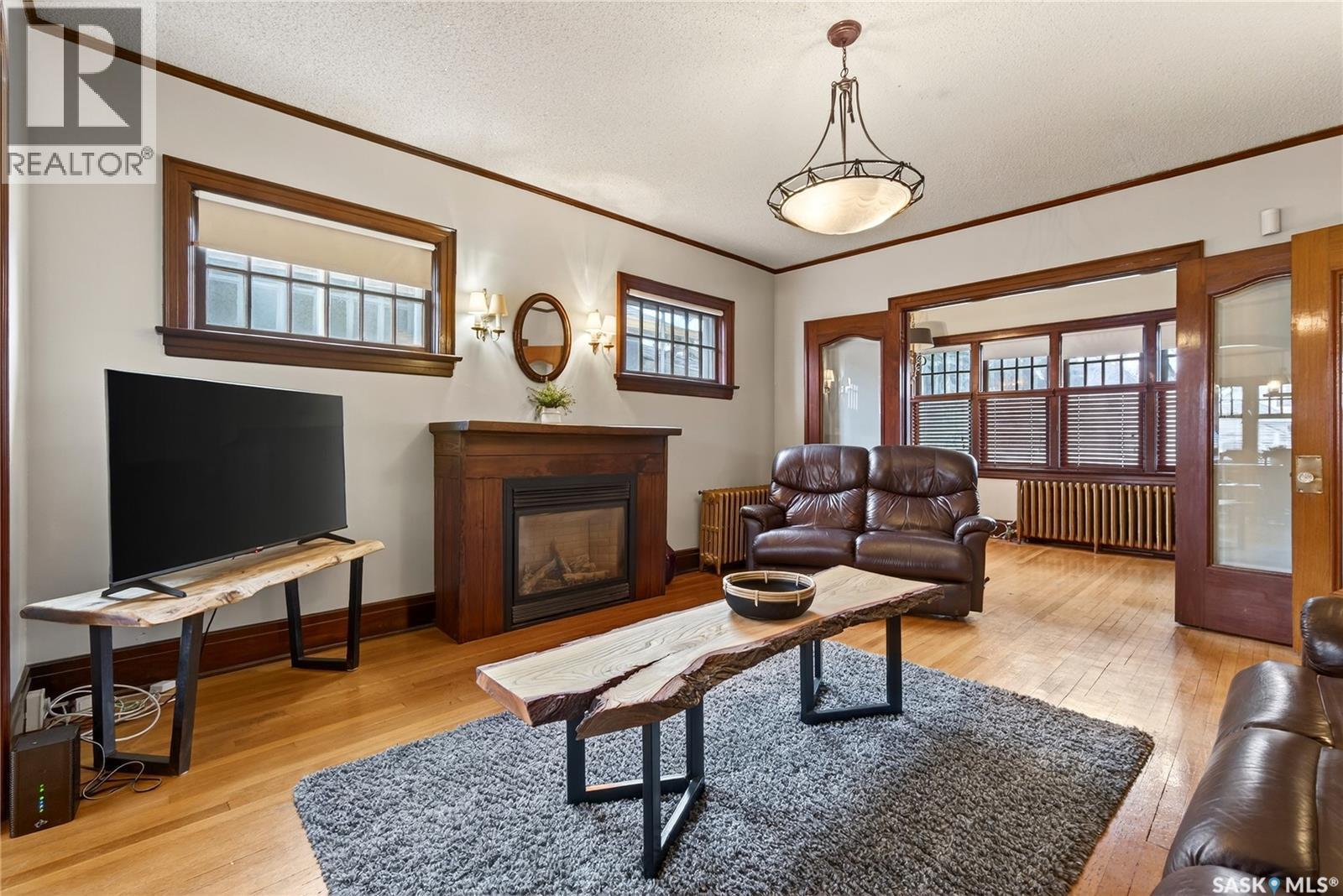 1334 Victoria Avenue, Regina, SK - Indoor Photo Showing Living Room With Fireplace