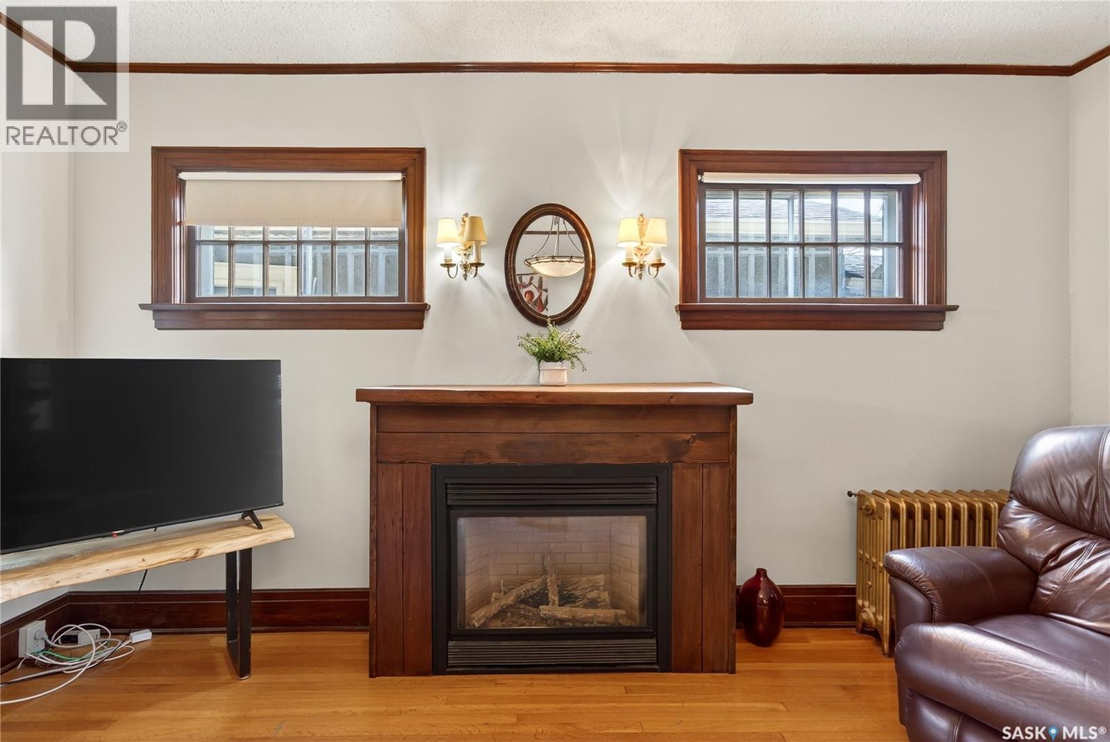 1334 Victoria Avenue, Regina, SK - Indoor Photo Showing Living Room With Fireplace