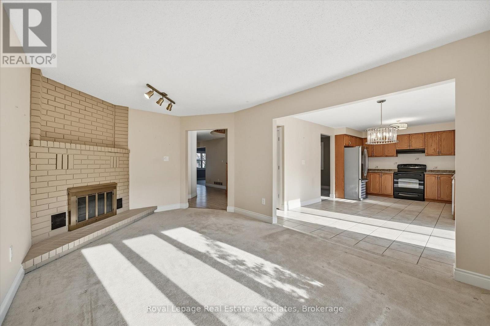 Family Room - 47 Elmira Drive, Hamilton, ON - Indoor Photo Showing Other Room With Fireplace