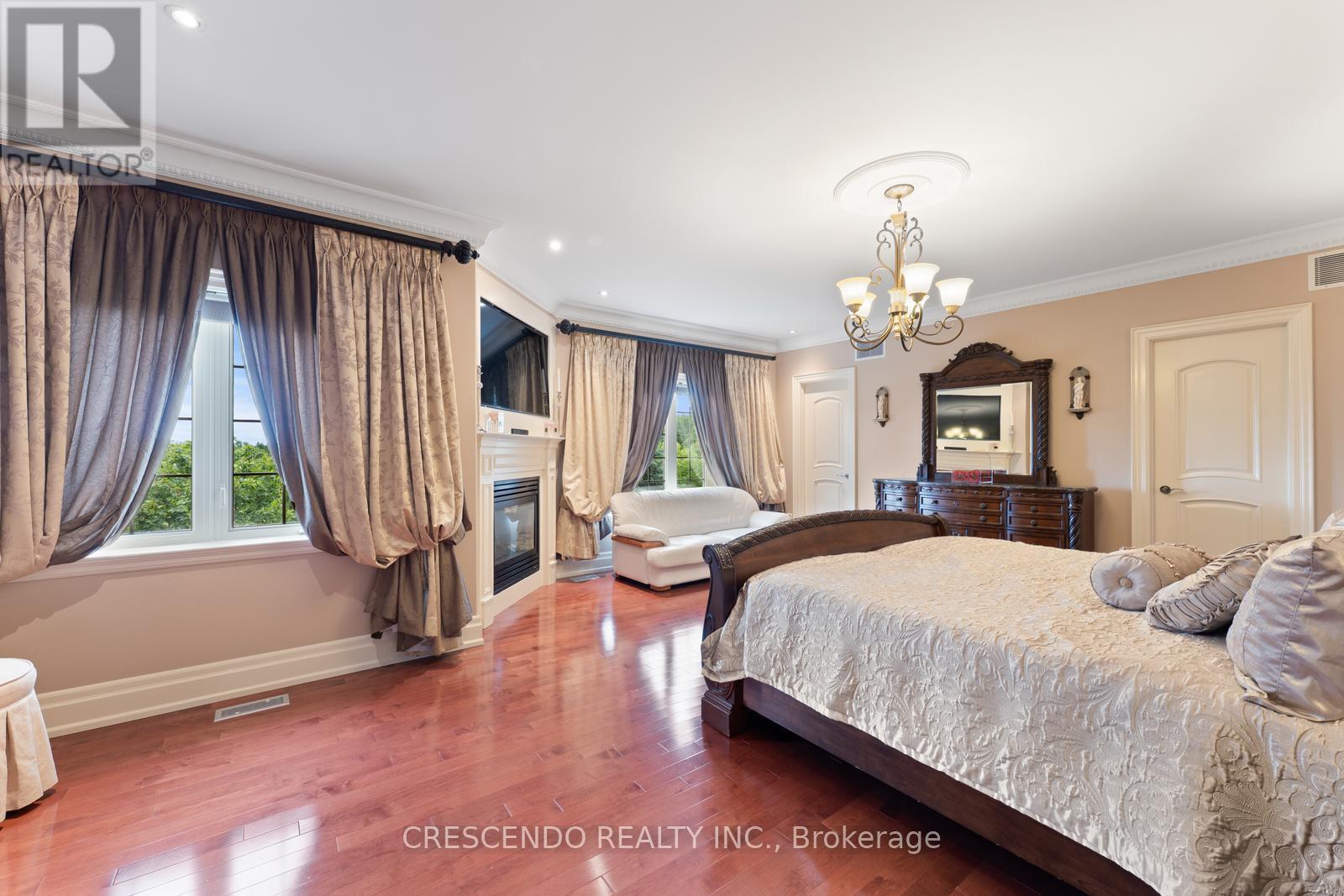 2 Prince Adam Court, King, ON - Indoor Photo Showing Bedroom With Fireplace