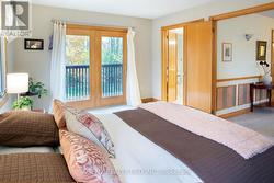 Master bedroom with a balcony -