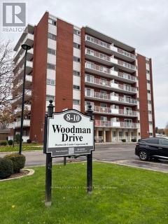 208 - 10 Woodman Drive S, Hamilton, ON - Outdoor With Balcony With Facade