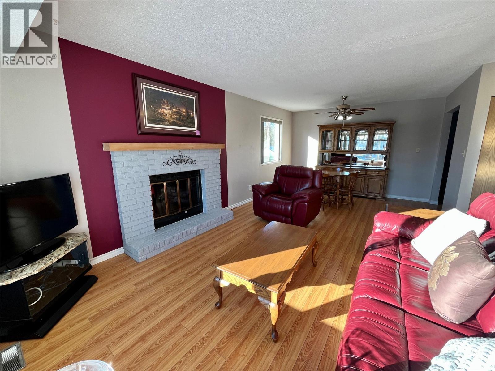 215 Peace River Crescent, Tumbler Ridge, BC - Indoor Photo Showing Living Room With Fireplace