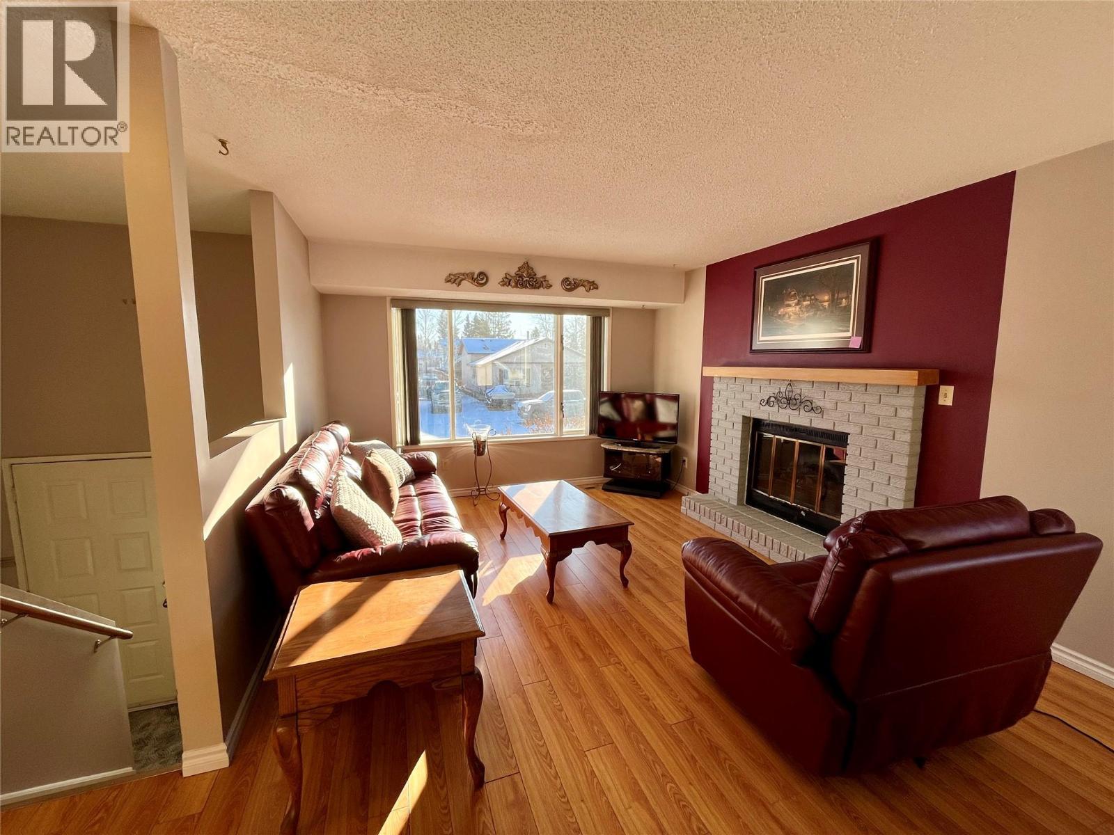 215 Peace River Crescent, Tumbler Ridge, BC - Indoor Photo Showing Living Room With Fireplace