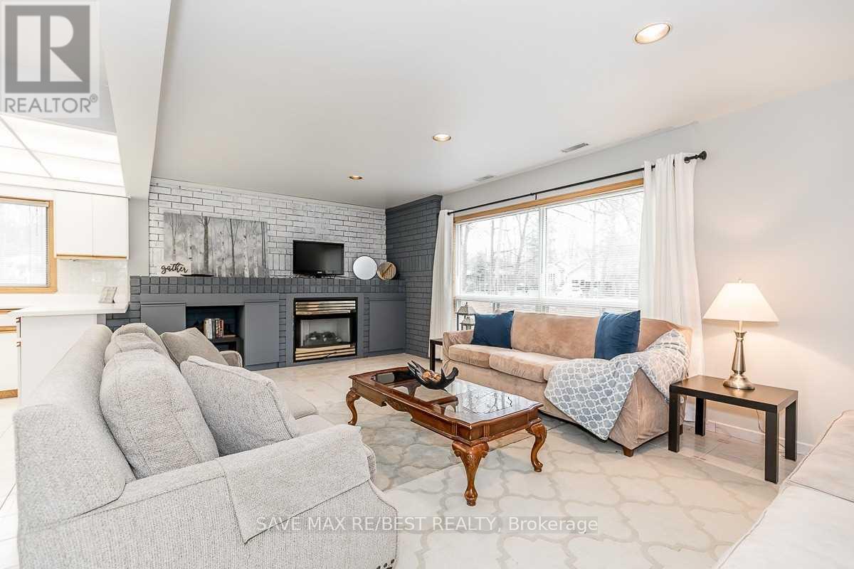 #B - 910 Concession Rd 17 W, Tiny, ON - Indoor Photo Showing Living Room With Fireplace