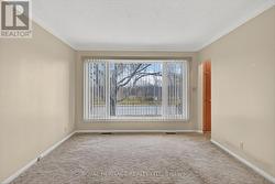 Living room with oversized window. -