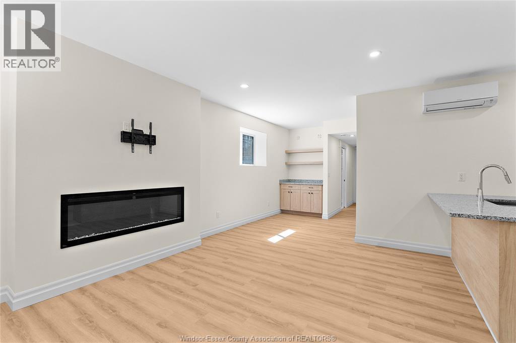 849 Ford Boulevard Unit# Lower, Windsor, ON - Indoor Photo Showing Living Room With Fireplace